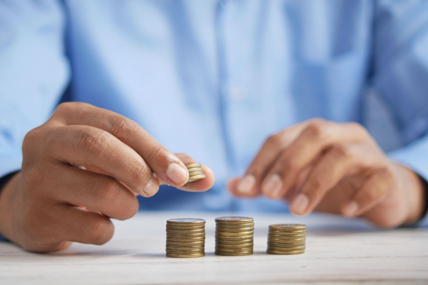 Stacking Coins and counting pennies. Knowing what you are worth is important to any employee