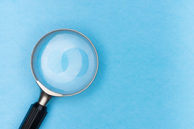Magnifying glass, signifying looking for a new job without your boss finding out